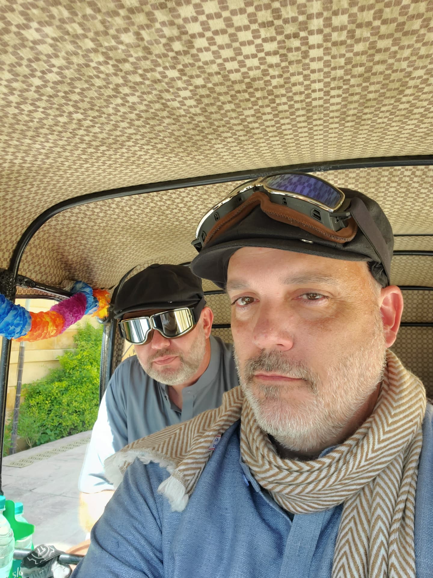 Matt Haney riding a tuk tuk with a forum member abroad